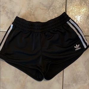 ADIDAS three-stripe black shorts.